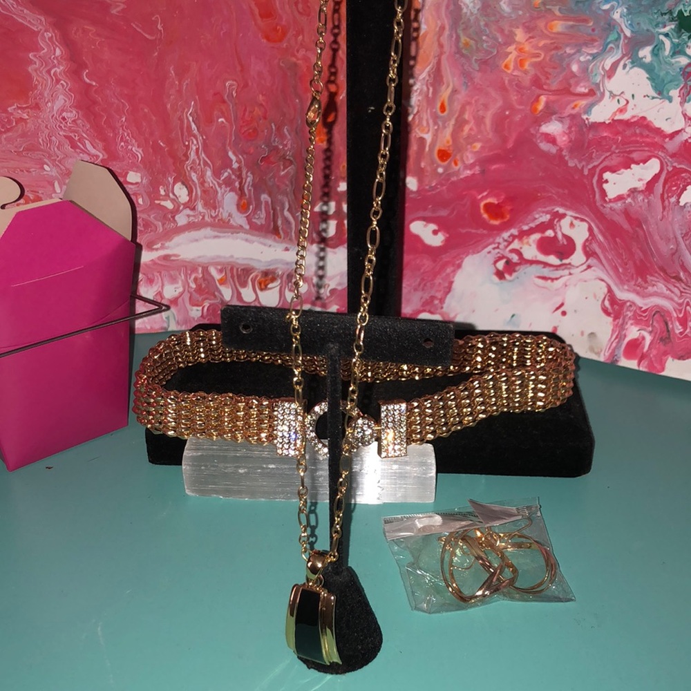 Two necklaces one pair of earrings